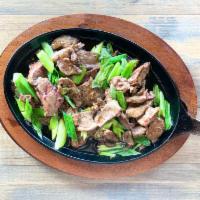Baby lamb liver Mediterranean style  · Fried liver on the pan with leek 