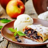 Apple Strudel with Ice Cream · Apple strudel wits raisins and Ice Cream