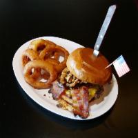 The BBQ Burger · 8 oz. fresh Angus beef, applewood smoked bacon, cheddar cheese, crispy onion strings, BBQ sa...