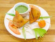 Samosas (2) · Dough pockets filled with Potato and Vegetable Mix. Served with sides of mint and tamarind/d...