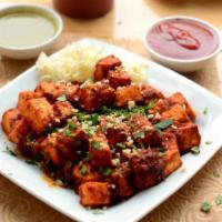 Paneer 555 · Paneer cubes cooked in special chili sauce and tossed with cashews. Spicy.