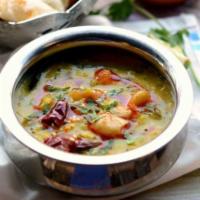 Dal Tadka · Yellow lentils sauteed with onions, tomatoes and spices. Served with choice of butter nan or...