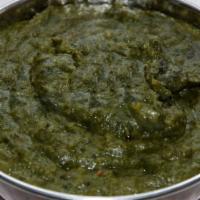 Saag Chana · Spinach cooked with garbanzo beans and spices