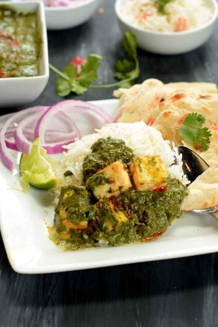 Saag Paneer · Spinach cooked with homemade cheese cubes and spice.