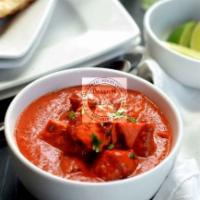 Chicken Tikka Masala · Grilled chicken chunks cooked in tomato sauce with a touch of cream. National dish of britai...