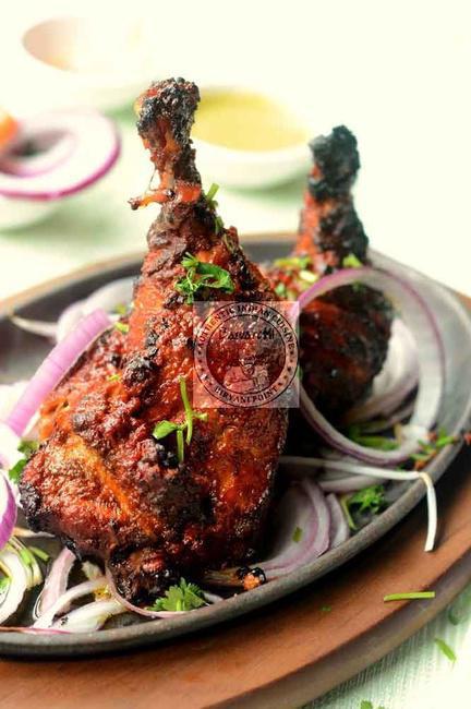 Tandoori Chicken (Half) · Grilled bone-in chicken marinated in yogurt, garlic, ginger, ground spices and grilled in Tandoor.