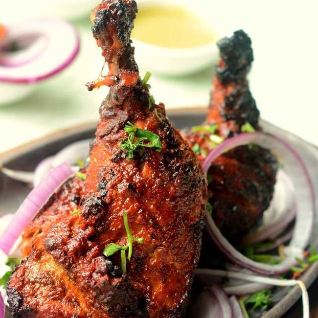 Tandoori Chicken (Full) · Grilled bone-in chicken marinated in yogurt, garlic, ginger, ground spices and grilled in Tandoor.