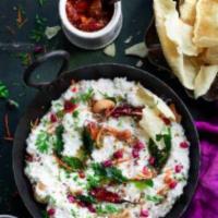 Curd Rice w/pickles · Freshly Made Indian curd (yogurt) rice Sauteed in Indian Spices and Curry Leaves. Served wit...