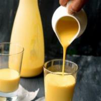 Mango Lassi (16oz). · Indian traditional yogurt based Mango drink (pro-biotic).