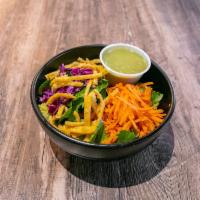 Side Salad · Romaine, purple cabbage, carrots, wonton crisps, and dressing.