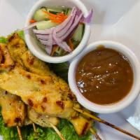 Satay · Skewers of seasoned choice of chicken, beef, pork or tofu served with a peanut sauce and cuc...