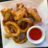 Calamari Rings · Deep-fried calamari rings with a light batter served with sweet chili sauce.