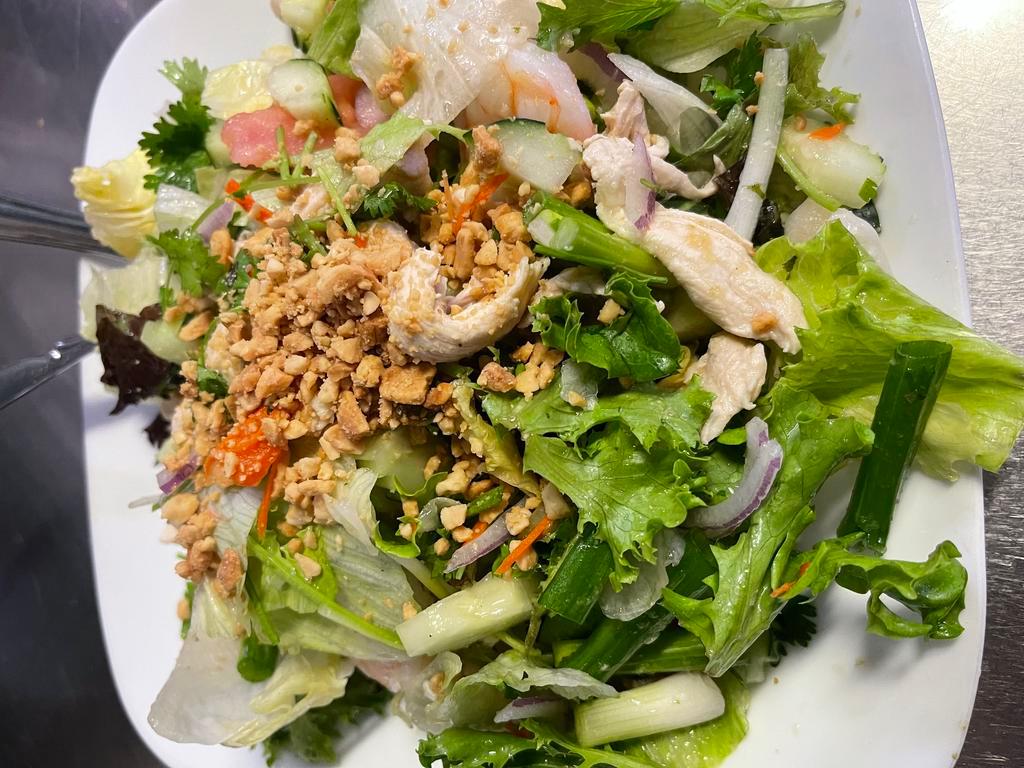 Yum Yai Salad · Shrimp, chicken, lettuce, cucumbers, tomatoes, bean sprouts, onions, cilantro and spicy chili lime dressing.
