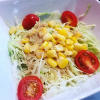 Cabbage Salad · Cabbage, cherry tomatoes, corn, and our house dressing.