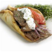 Gyro Wrap · Our famous Chicago style lamb and beef gyro. served with homemade tzatziki sauce, lettuce, o...