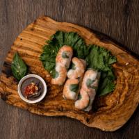 Fresh Summer Rolls · Soft rolls (2) with steamed pork and shrimp, basil, mint, lettuce, vermicelli wrapped in ric...