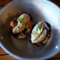 Baked Potato · (GF) Grilled baked potato served with aioli truffles and garlic confit.