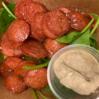 Kielbasa Sausage Snack  · *this is a snack! small portion!*
a Polish sausage cut up in to thin slices with a garlic tr...