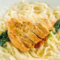 Grilled Chicken Alfredo Pasta · Grilled chicken breast on top of Linguine with Alfredo sauce, sautéed spinach and red peppers 
