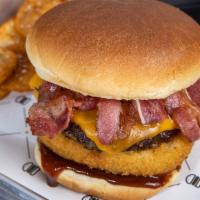  The Cowboy BurgerIM · 1/3 lb. patty, BBQ, onion ring, bacon and cheddar cheese.