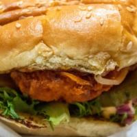 Crispy Chicken Burger · 1/4 lb. chicken, house sauce, caramelized onions, mixed greens, pickles and Buffalo sauce. *...