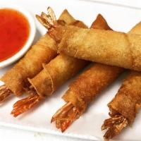 Shrimp Rolls · 5 pieces. Fried shrimp wrapped in spring roll skin with sweet chili sauce.