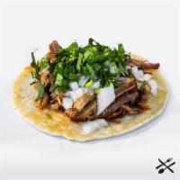 Carnitas Taco · Slow cooked pork, onion, cilantro, corn tortilla