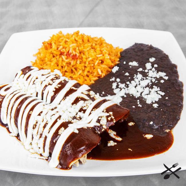 Mole Enchiladas (2) · Mexican rice, refried black beans, sour cream, queso fresco, corn tortilla, sweet mole