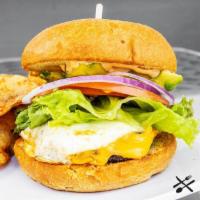 Spanglish Burger · 100% Angus beef, american cheese, lettuce, tomato, onion, egg, avocado, aioli, brioche bun, ...
