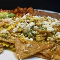 Chilaquiles Plate · Fried tortilla strips, 2 scrambled eggs, serranos, onions, tomatoes, tomatillo sauce and mex...