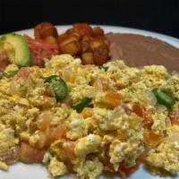 Huevos a la Mexicana Plate · 3 scrambled eggs, cooked with fresh onions, tomatoes and serrano peppers, served with refrie...