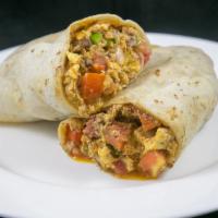 Breakfast Burrito · 3 scrambled eggs with breakfast meat, sauteed onions, bell peppers and tomatoes.