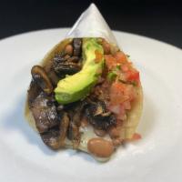 Super Veggie Taco · Fresh sauteed mushrooms in 2 corn tortillas, with melted cheese, whole beans, salsa fresca &...