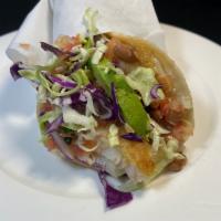 Super Fish Taco · Grilled filet of fish in 2 corn tortillas, salsa fresca, cabbage, cheese, and avocado.