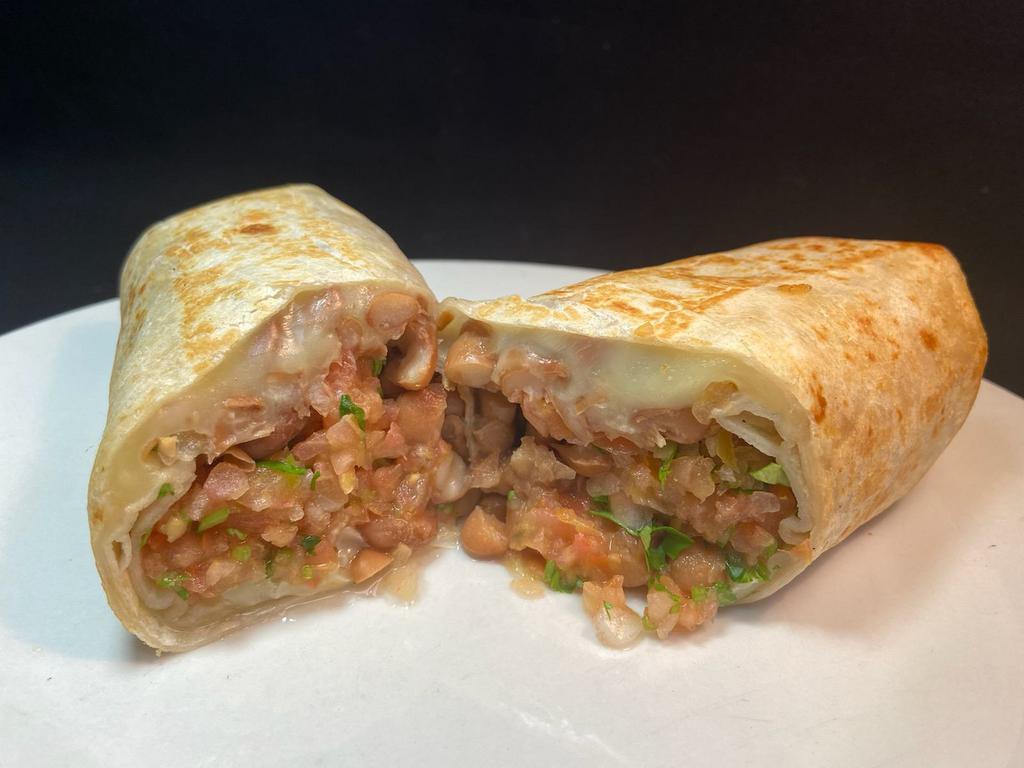 Regular Veggie Burrito · Whole pinto beans, in a flour tortilla with melted cheese and salsa fresca.