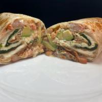Super Chile relleno Burrito · A chile relleno Super burrito in a flour tortilla with whole beans, cheese, salsa fresca, av...