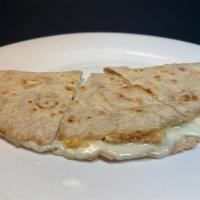 Gluten Free Teff Grain Quesadilla · Grilled teft grain tortilla with cheese.