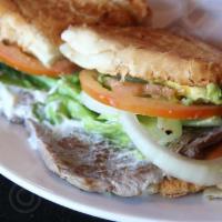 Torta with Steak · Served with mayonnaise, sour cream, cheese, lettuce, tomato, onion and avocado.