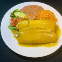 2 Tamales Plate · Homemade corn dough tamales made with Chicken, pork or veggies served with Mexican rice, ref...