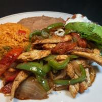 Fajitas Plate · Meat of your choice with sauteed bell peppers, onions & tomatoes ,served with refried beans,...