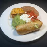 Chimichanga Plate · Deep fried burrito with meat of your choice , melted cheese, served with guacamole, sour cre...
