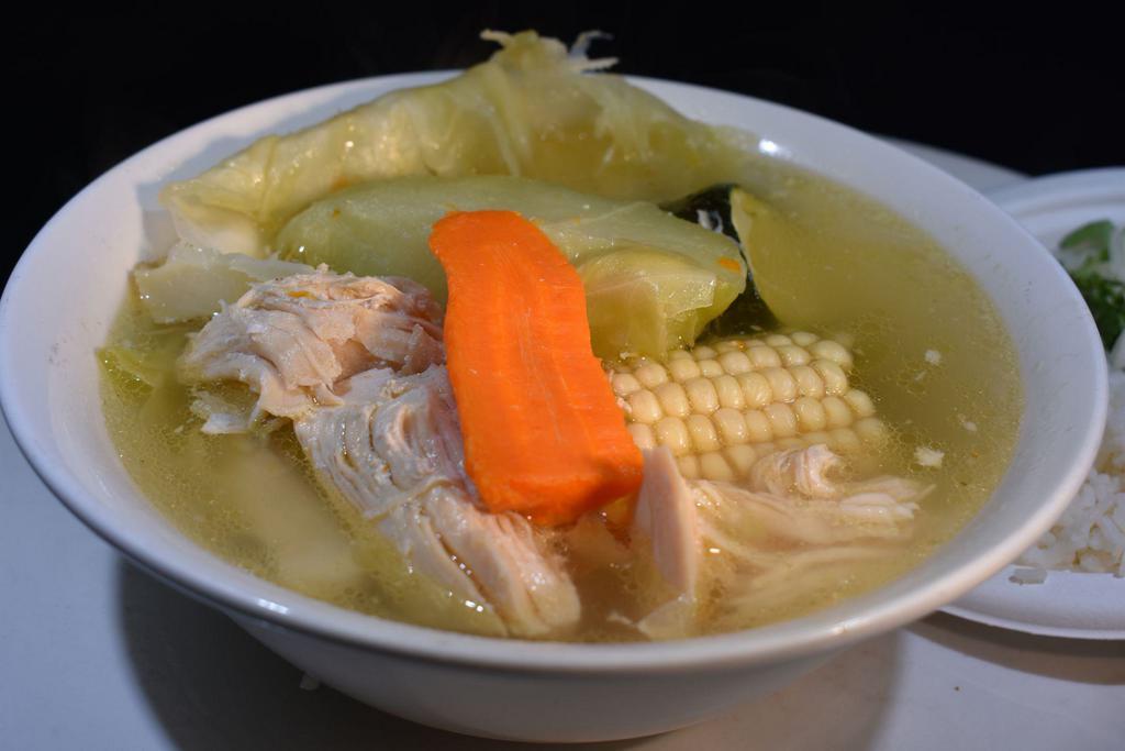 Caldo de Pollo · Chicken broth with chicken  made daily served with corn, carrots, chayote, corn & rice on the side.  Served with 4 corn or 3 flour tortillas. 