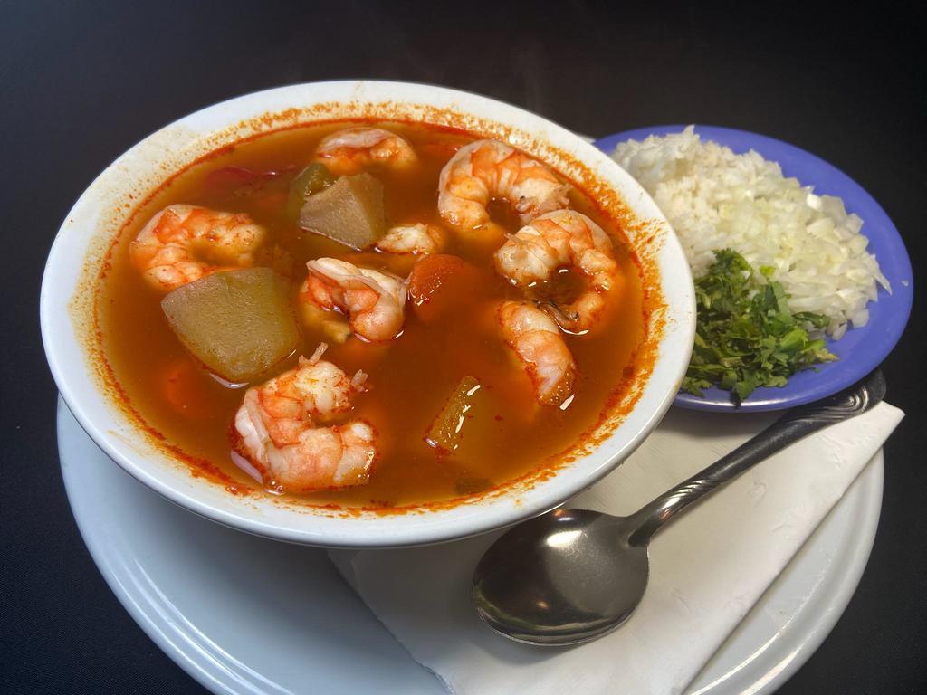 Caldo de Camarones · Large prawns soup with vegetables. Served with 4 corn or 3 flour tortillas.  On the side rice, cilantro, onion & spices.