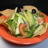 Side Salad · Romaine lettuce, spring mix, tomatoes, avocado, onion, olive, and cucumber. Your choice of r...