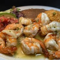 Camarones al Mojo de Ajo · Large sauteed prawns in fresh garlic sauce served with refried beans, Mexican rice, salad & ...