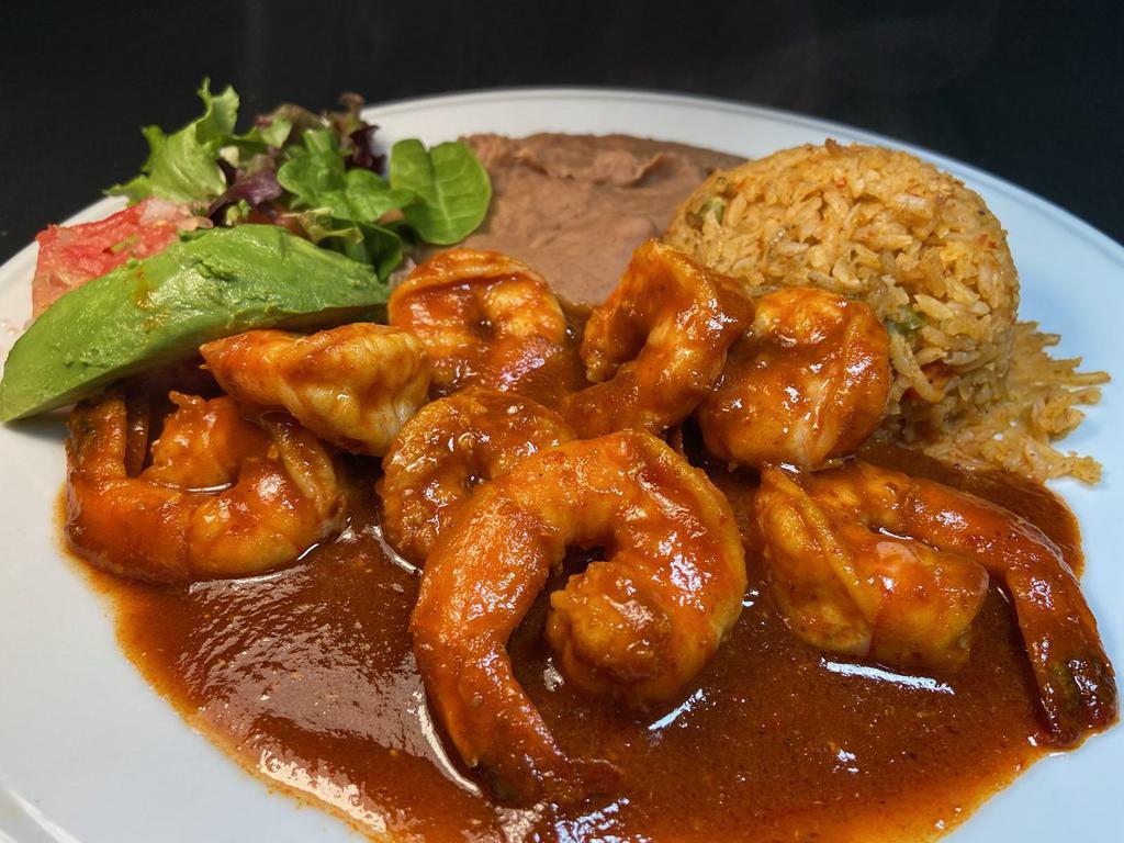 Camarones a la Diabla · Large sauteed prawns in hot spicy sauce served with refried beans, Mexican rice, salad & avocado slice. Your choice of  4 corn or 3 flour tortillas.