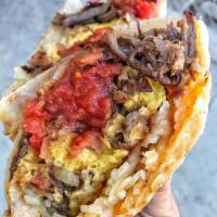 Machaca Breakfast Burrito · Shredded beef mixed with eggs, green bell pepper, onion blend, tomatoes, tortilla chips, has...