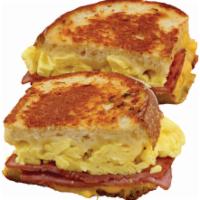 Ham and Egg Melt Breakfast · 2 omelette-style eggs, grilled sliced ham, Swiss and American cheese in grilled sourdough br...