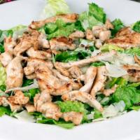 Grilled Chicken Caesar Salad · Grilled marinated chicken breast strips, shredded Parmesan cheese, Caesar dressing and toppe...