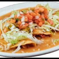 Tacos Ahogados · 3 made to order fried stuffed with flavorful potato topped with yummy chilaquile sauce, cove...